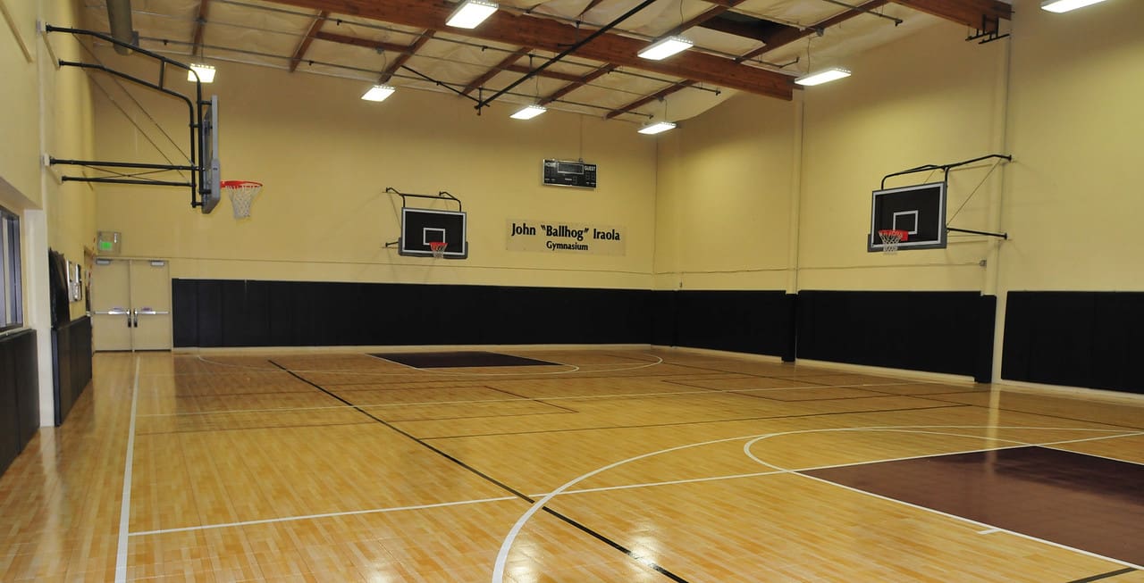 A basketball court with a wall of lights