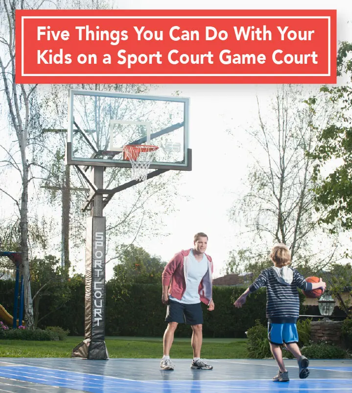 Two men playing basketball on a court with trees in the background.