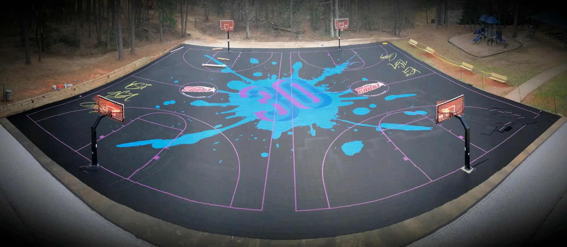 A basketball court with blue paint on it