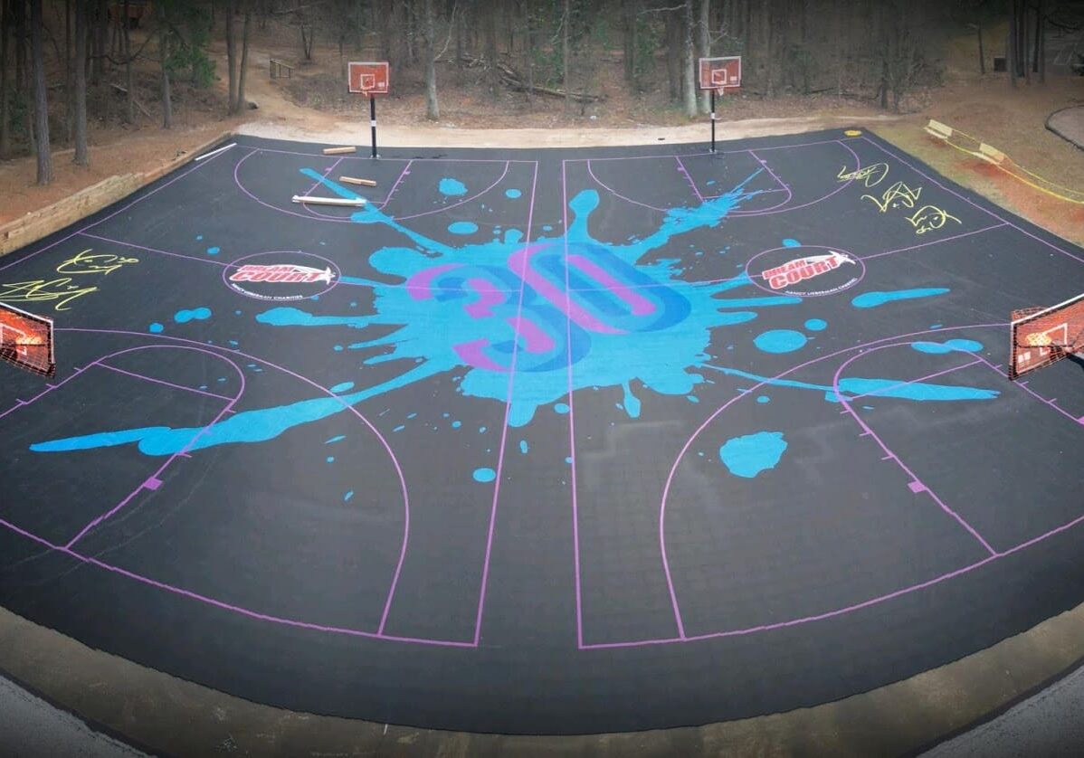 A basketball court with blue paint on it